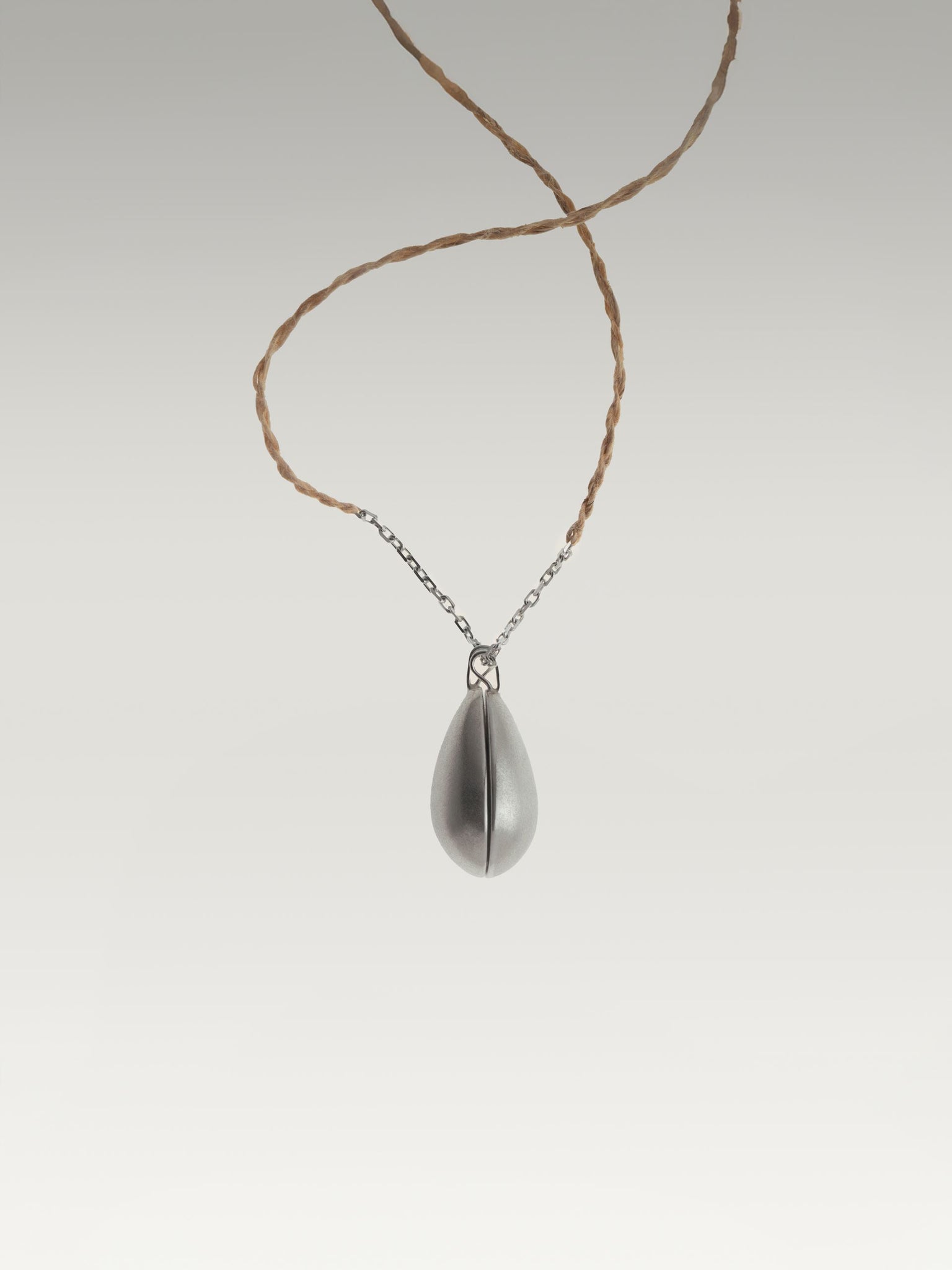 Two halves of one egg pendant