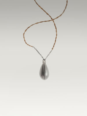 Two halves of one egg pendant