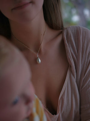 Two halves of one egg pendant