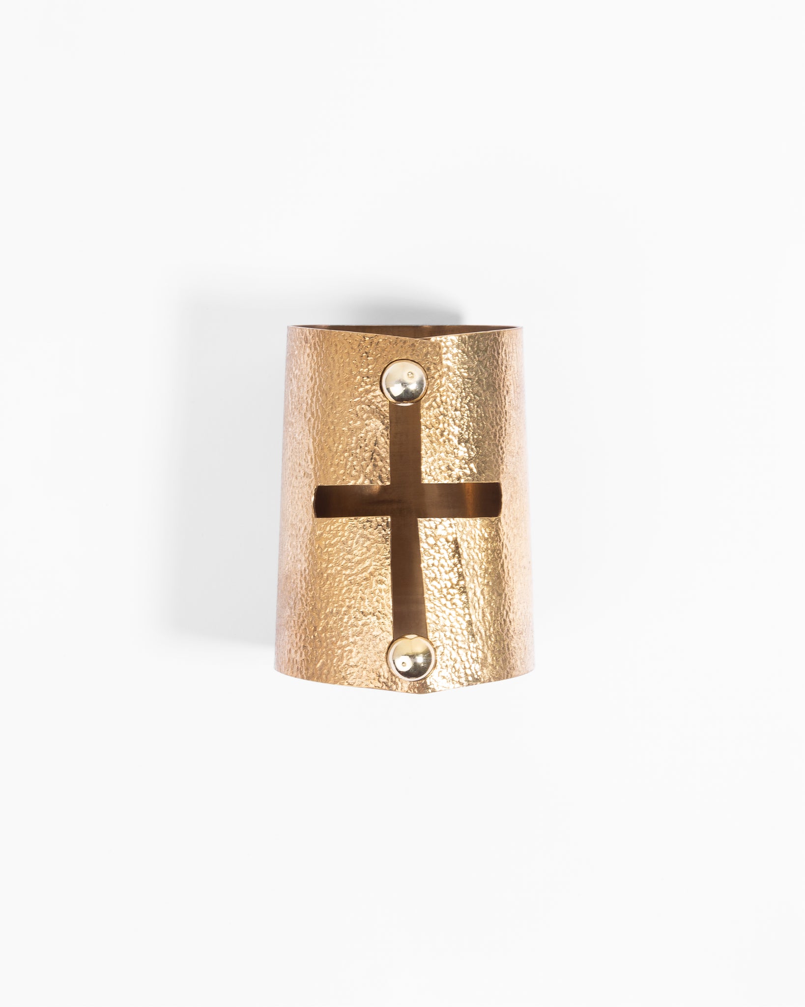 Handcrafted solid bronze bracelet depicting rounded cross with apple buttons