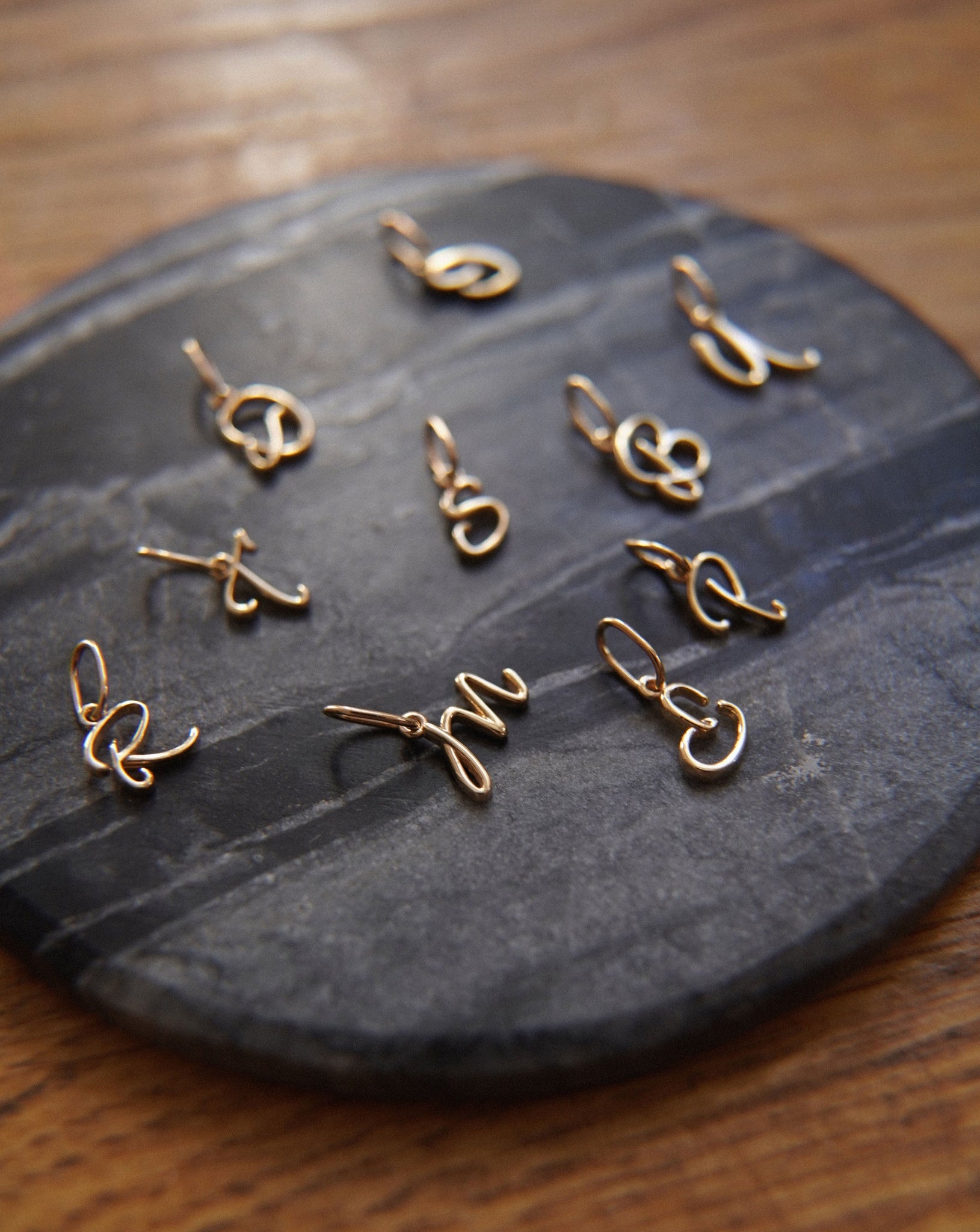 Gold necklace with a letter